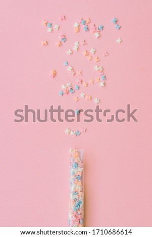 Sprinkles grainy. Sweet confetti. Pink background for holiday designs, party, birthday