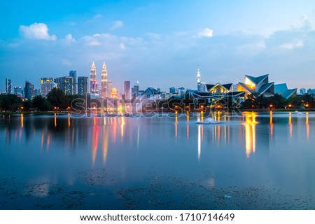 Kuala Lumpur, Malaysia. Sunrise City skyline with The Twin Towers from Titiwangsa lake. Royalty-Free Stock Photo #1710714649