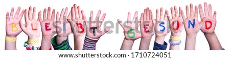 Kids Hands Holding Word Bleibt Gesund Means Stay Healthy, Isolated Background