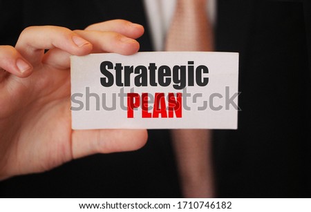Strategic plan on catf in businessman had. Business plan concept.