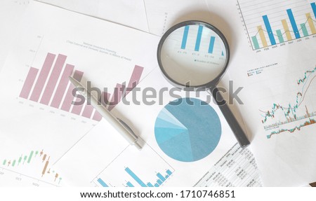 Stock Market Analysis magnifier graphics business Royalty-Free Stock Photo #1710746851