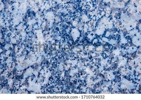 smooth surface of gray spotted marble with brown veins, background with natural building material