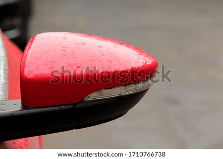 red rear view mirror of the car