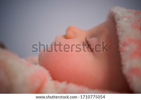 Close-up portrait of adorable little baby girl sleeping and wear cute bear costume 