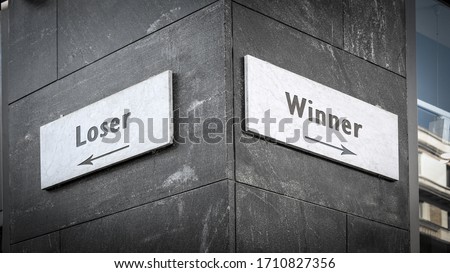 Street Sign the Direction Way to Winner versus Loser Royalty-Free Stock Photo #1710827356