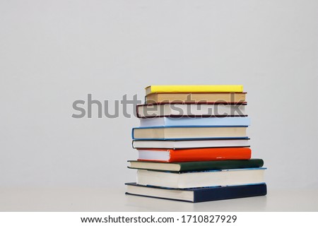 Stack of books on white background Royalty-Free Stock Photo #1710827929