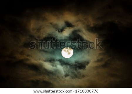 When taking pictures of the moon who wants to hide behind the black clouds on the roof of the house
