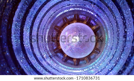 blue light in the tunnel glistens in water droplets in creative photo