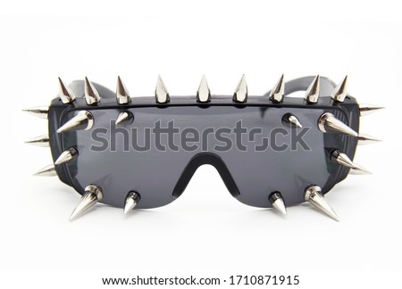 Men's sunglasses. Rocker glasses. Stylish glasses with spikes. Glasses on a white background.