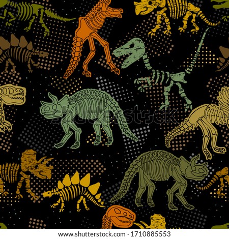 Dinosaur skeleton. Vector seamless pattern. Original design with dinosaur bones. Black background with dots. Desing for textile, clothes. Royalty-Free Stock Photo #1710885553