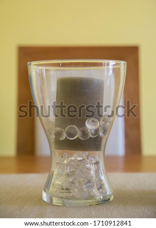 A glass container that inside there are diamonds.