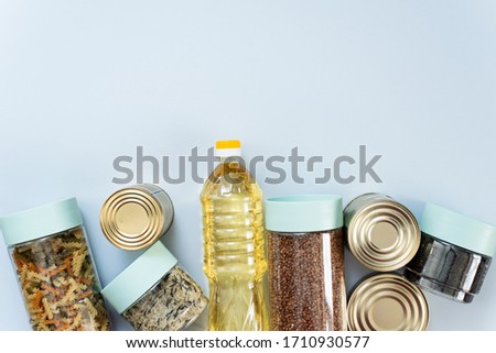 Cereals, various products, canned food, pasta and soap with place for text. Humanitarian assistance during the coronavirus pandemic. Stock of non-perishable food items Royalty-Free Stock Photo #1710930577