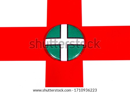 A badge portraying the flag of the English county of Devon pictured over the England flag.