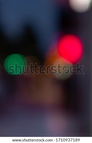 Abstract texture in cities - blurred background with bokeh lighting at night on the street