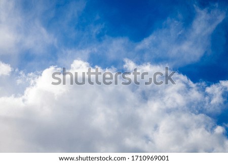 white clouds on a blue sky. background for design