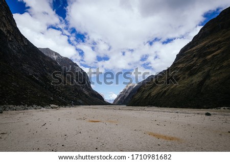 remains of an avalanche in the valley, in the trekking of the quebrada santa cruz between mountains, peru