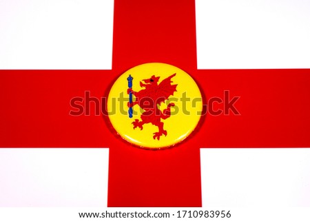 A badge portraying the flag of the English county of Somerset pictured over the England flag.