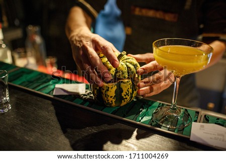 the bartender prepares a cocktail in the style of Halloween