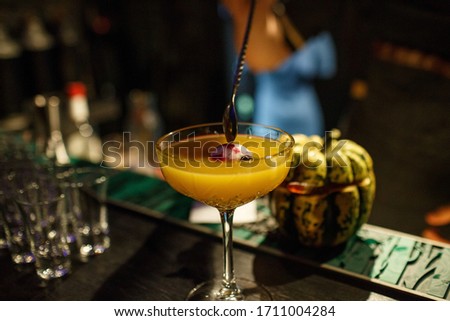the bartender prepares a cocktail in the style of Halloween