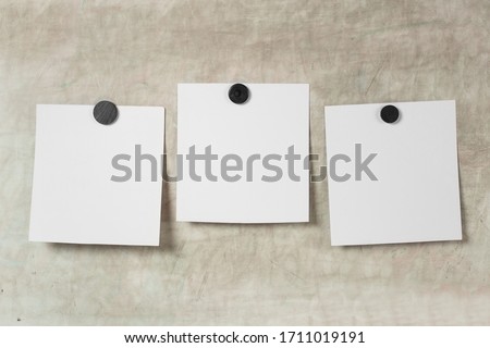 Blank photo frame with soft shadows and  magnet tape isolated on grey paper background as template for graphic designers presentations, portfolios etc. kids. magnetic board
