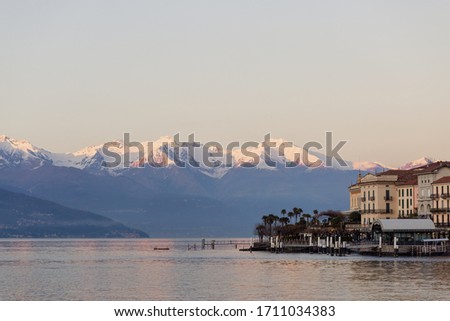 Beautiful landscape of the Italian lake Como. Silence nature calm peace. Blue water of Alps mountains. Italy bellagio. Travel vacation travel contemplation  sky fog sunset early morning bellagio