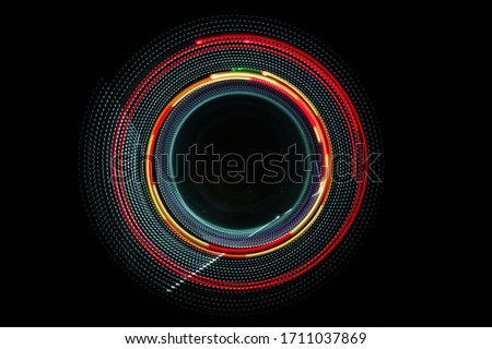 Modern graphic images With various colored lights, taken with a camera using slow shutter speed technique in a circular motion, can be used as a background