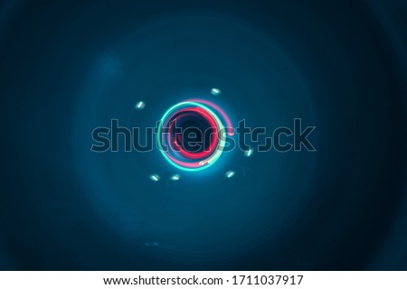 Modern graphic images With various colored lights, taken with a camera using slow shutter speed technique in a circular motion, can be used as a background