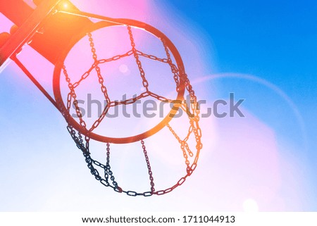 street basketball court ring board against the sky. bright sunny day