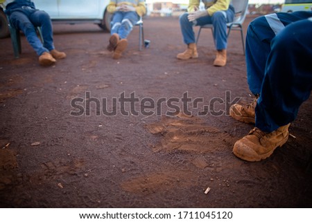 Safety workplace side view clear pic of construction worker safety boot setting on the chair maintains 1.5 M, 6 feets social distancing prevention of Coronavirus -19 during prestating morning shift  Royalty-Free Stock Photo #1711045120