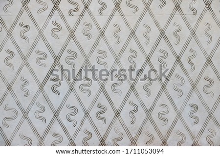 beautiful wall pattern and decoration in old buildings in Milan, Italy