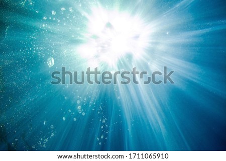 Underwater picture - sea surface with sun rays