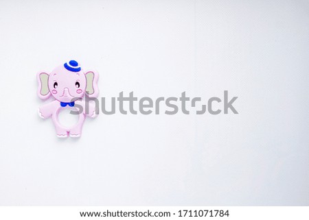 Children's toys in the form of animals on a white background. Place for text