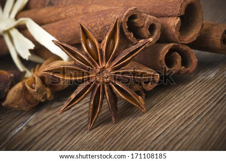 cinnamon sticks and anise on wooden table 