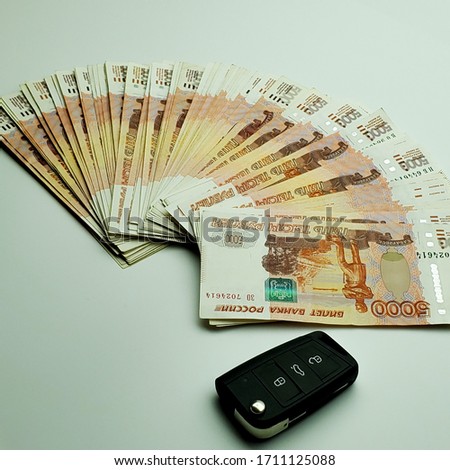 Russian money. Russian money and car keys. Buying a car.
