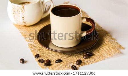 turkish coffee, coffee beans on a wooden spoon, brown, anise.selectiv focus
