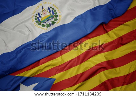 waving colorful flag of catalonia and national flag of el salvador. macro