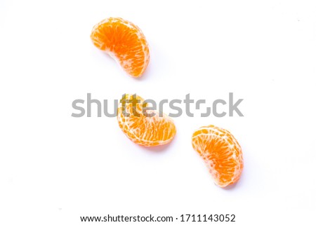 Tangerine slices on a white background