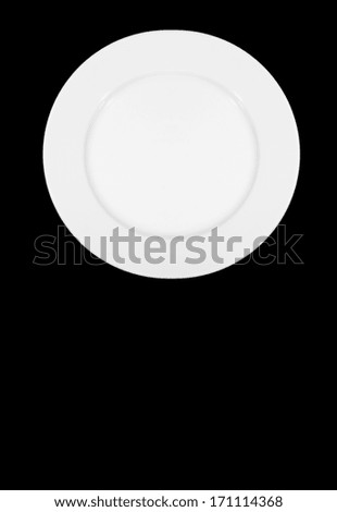 perfect white plate isolated on black background 