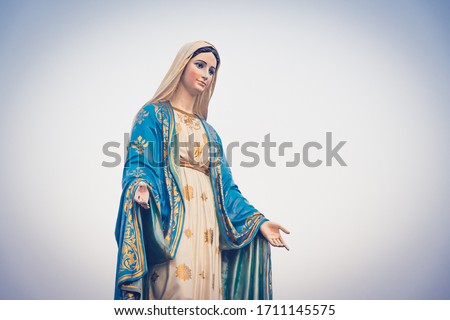 The blessed Virgin Mary statue figures at sunset time. Catholic praying for our lady - The Virgin Mary. Faith and Trust in Christian Catholic. Royalty-Free Stock Photo #1711145575