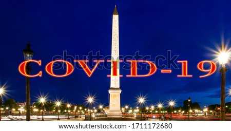 Coronavirus in Paris, France. Covid-19 sign. Concept of COVID pandemic and travel in Europe. Place de la Concorde and  Obelisk of Luxor at night