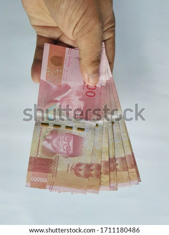 Indonesian rupiah money in hand