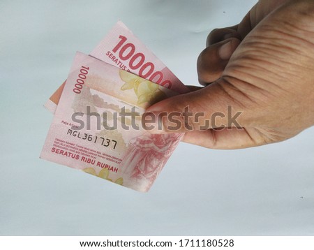 Indonesian rupiah money in hand