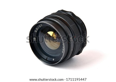 Old soviet photo lens on a white background.  Royalty-Free Stock Photo #1711195447