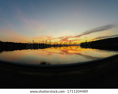 photo of sunset that occurs over the lake