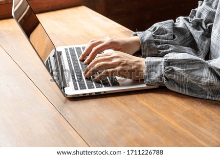 Picture of business woman working at home with her laptop.