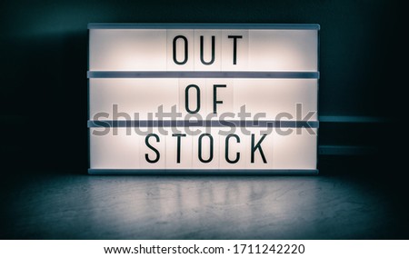Covid-19 OUT OF STOCK store lightbox sign showing text message for shortage of PPE medical supplies. Coronavirus panic hoarding led to sold out shelves. shortage of hand sanitizer, mask products. Royalty-Free Stock Photo #1711242220