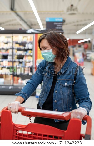 Woman with  mask shopping in supermarket