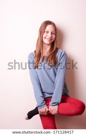 Portrait of a cute smiling teen girl