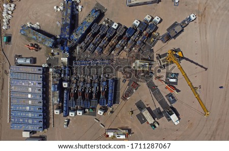 Aerial photo of hydraulic fracturing equipment. (FRACKING) Royalty-Free Stock Photo #1711287067