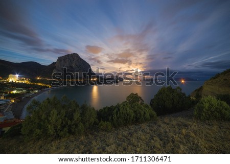 Landscape with clouds and beautiful evening sky with mountain and moonrise